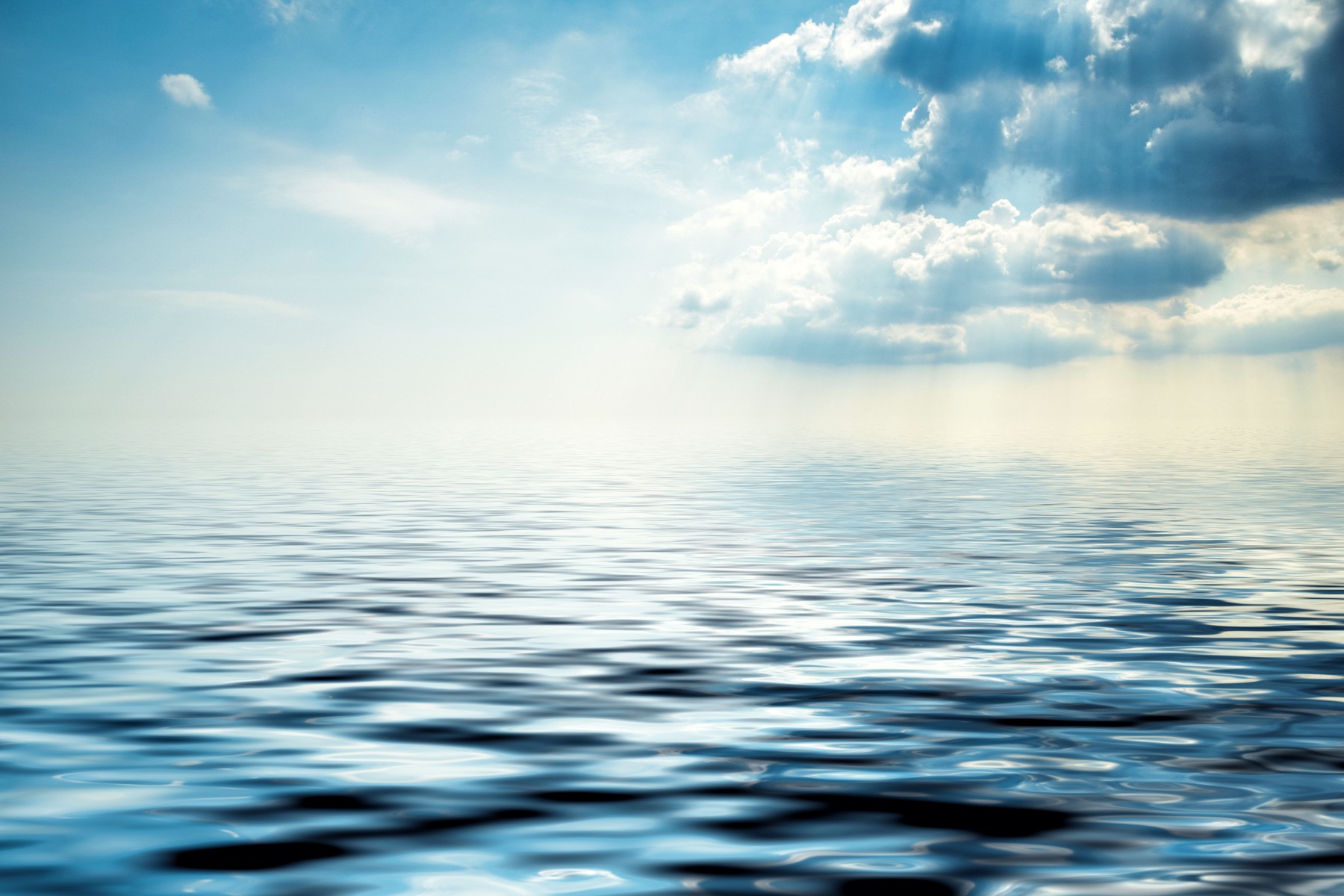 Soft ocean waves meeting a quiet shoreline